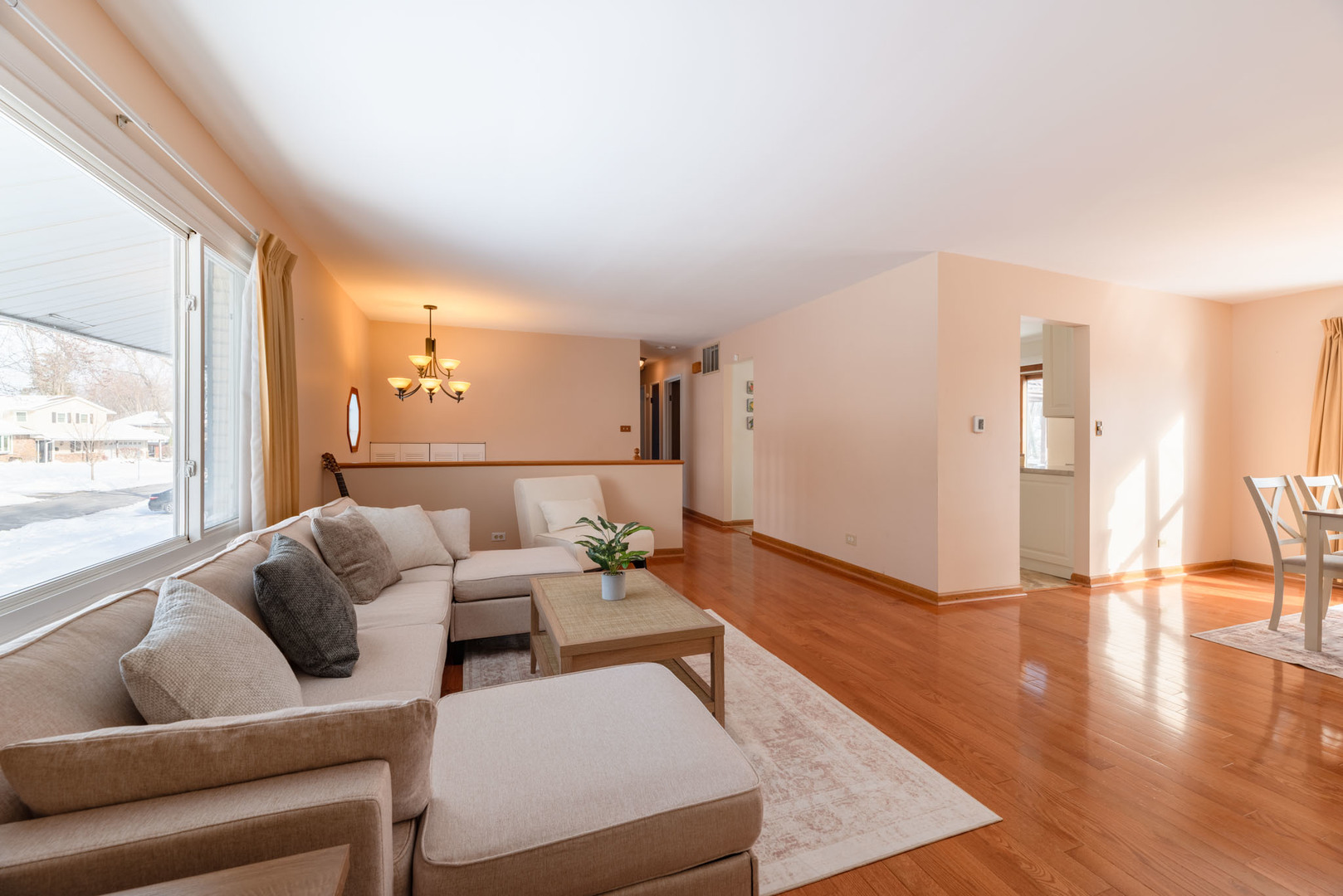 795 Plymouth Road Hoffman Estates, IL 60192 - Photo 4 of 26 a living room with furniture and a large window