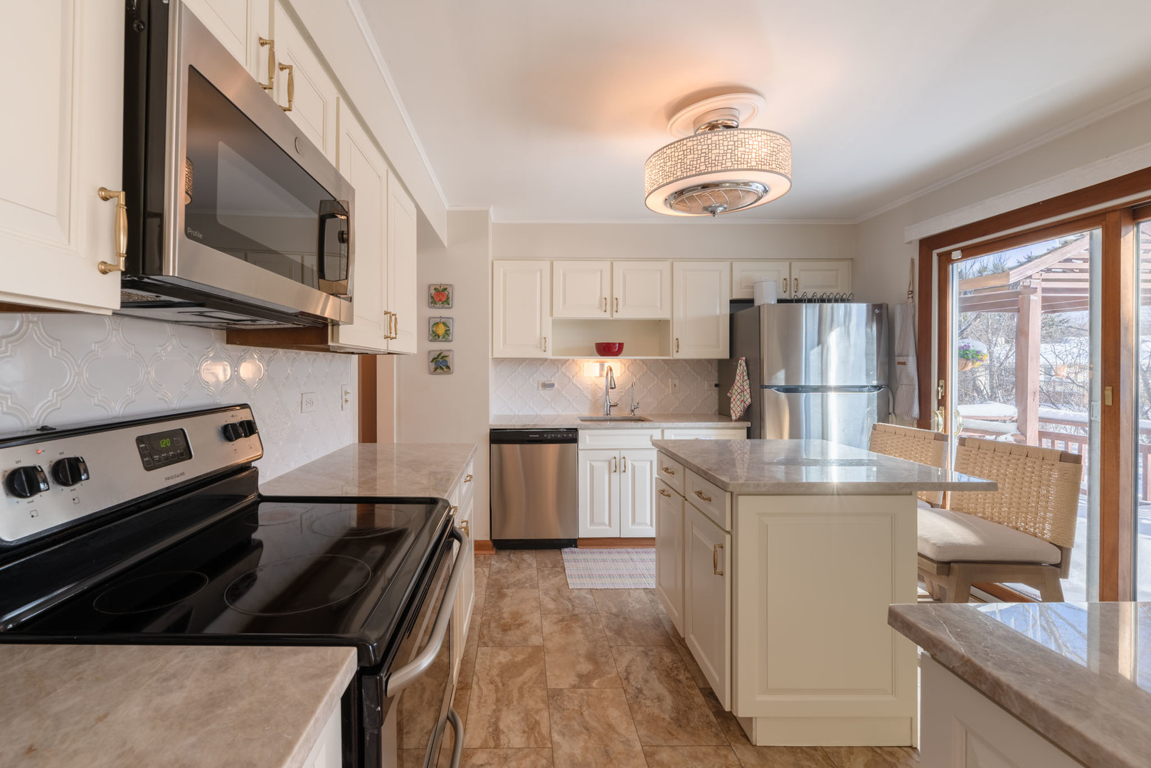 795 Plymouth Road Hoffman Estates, IL 60192 - Photo 8 of 26 a kitchen with stainless steel appliances granite countertop a stove a sink dishwasher and a refrigerator