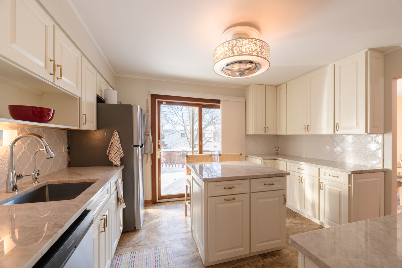795 Plymouth Road Hoffman Estates, IL 60192 - Photo 9 of 26 a kitchen with stainless steel appliances granite countertop a sink stove and cabinets