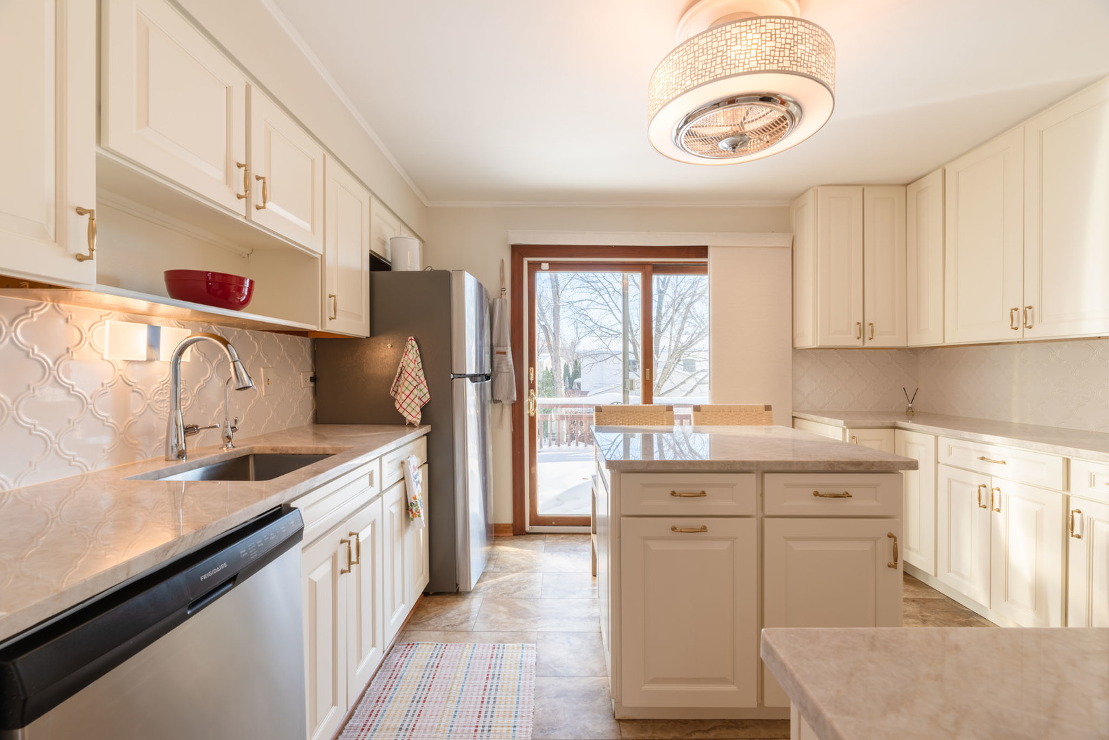 795 Plymouth Road Hoffman Estates, IL 60192 - Photo 10 of 26 a kitchen with a sink stove and cabinets