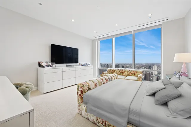 a bathroom with a sink a mirror and a shower