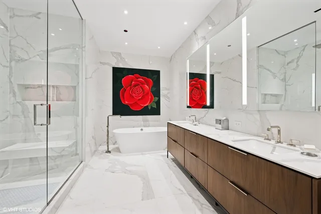 a bathroom with a tub and a shower