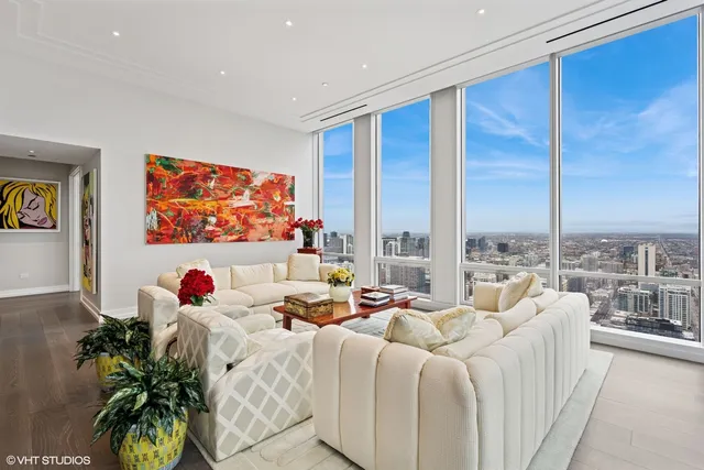 a kitchen with a sink a stove and white cabinets