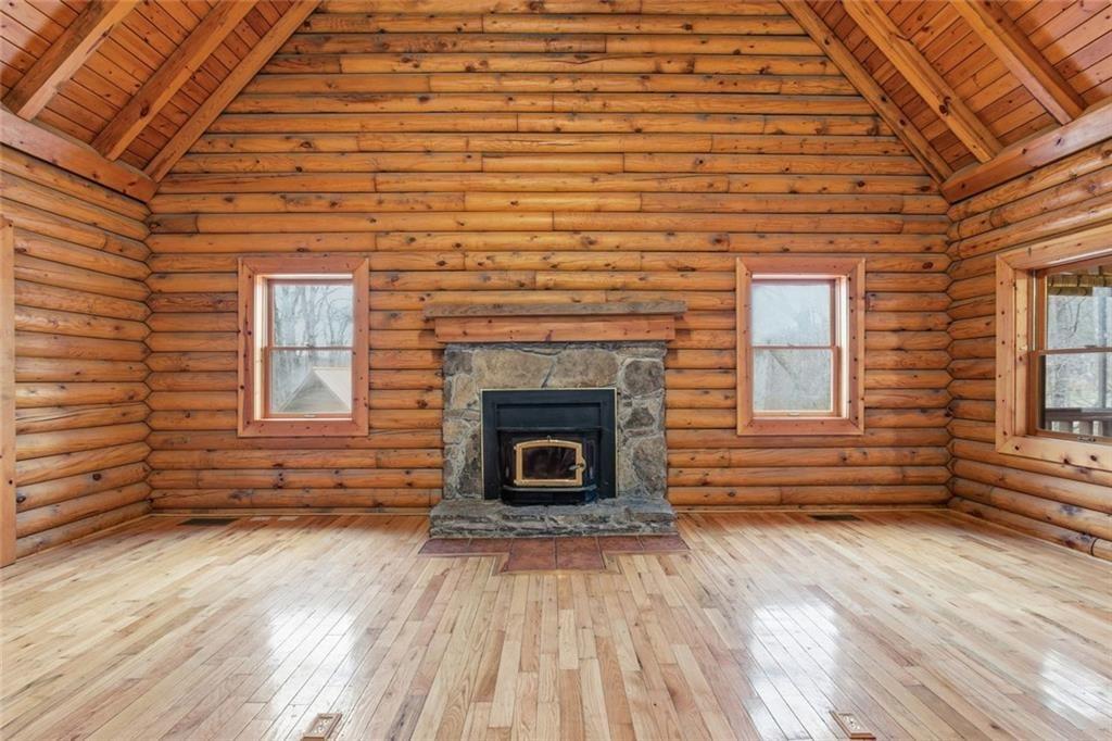 61 Bear Ridge Road Cleveland, GA 30528 - Photo 13 of 71 a view of a livingroom with wooden floor and a fireplace