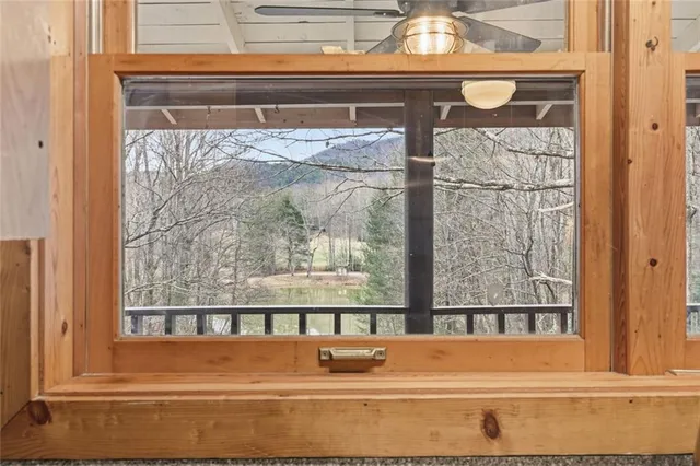 an empty room with large windows