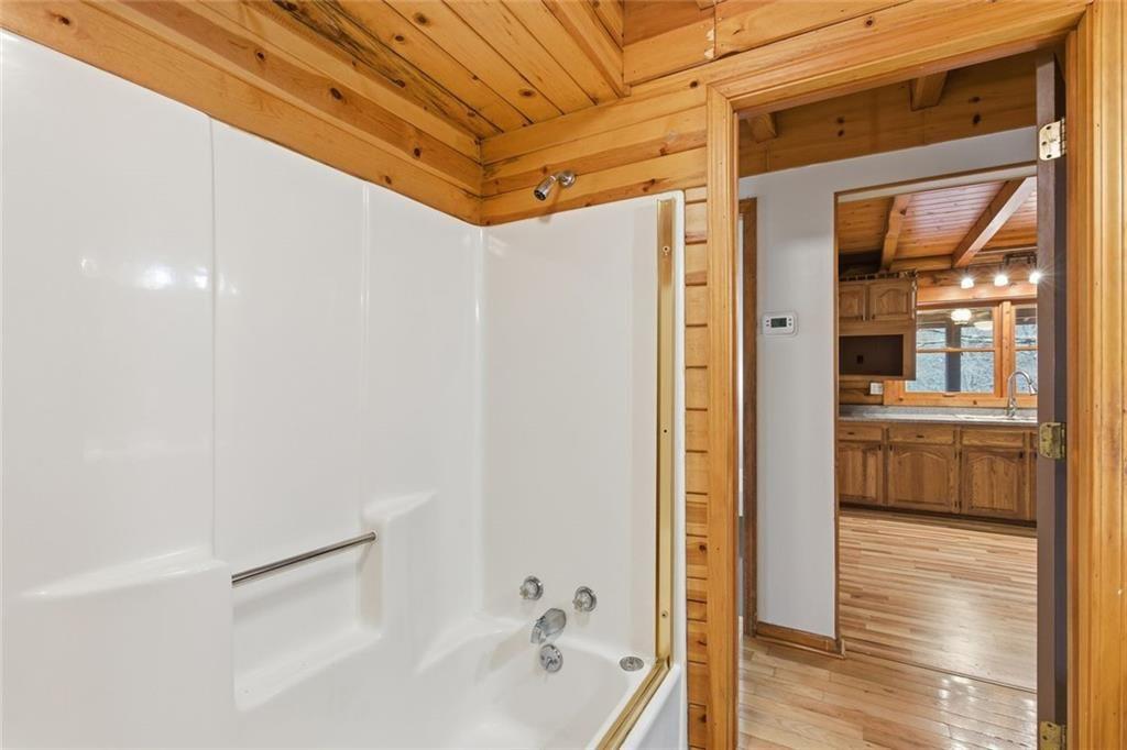 61 Bear Ridge Road Cleveland, GA 30528 - Photo 20 of 71 a bathroom with a bathtub and a shower