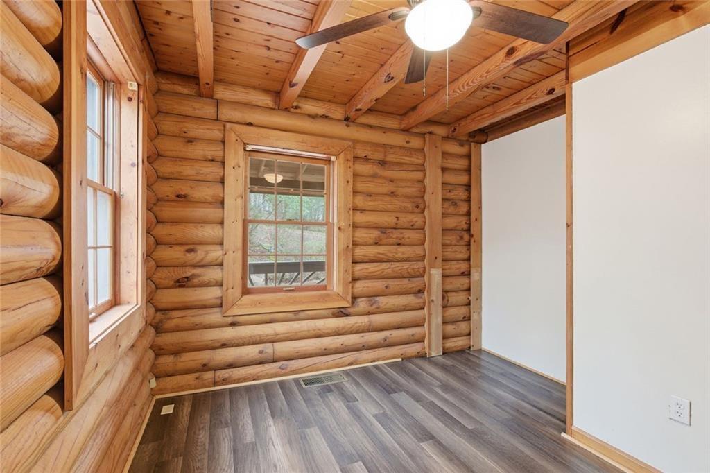 61 Bear Ridge Road Cleveland, GA 30528 - Photo 22 of 71 a view of walk in closet with empty racks
