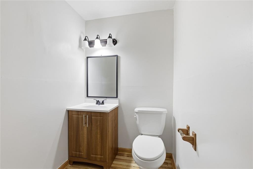61 Bear Ridge Road Cleveland, GA 30528 - Photo 39 of 71 a bathroom with a toilet sink and mirror