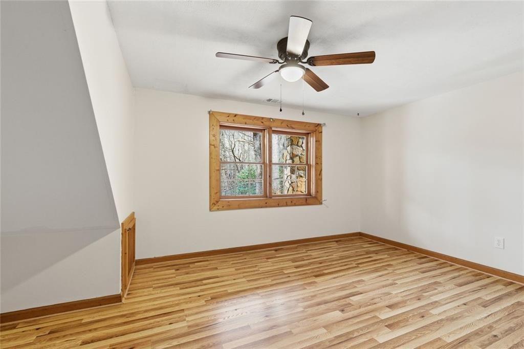 61 Bear Ridge Road Cleveland, GA 30528 - Photo 40 of 71 wooden floor in an empty room with a window