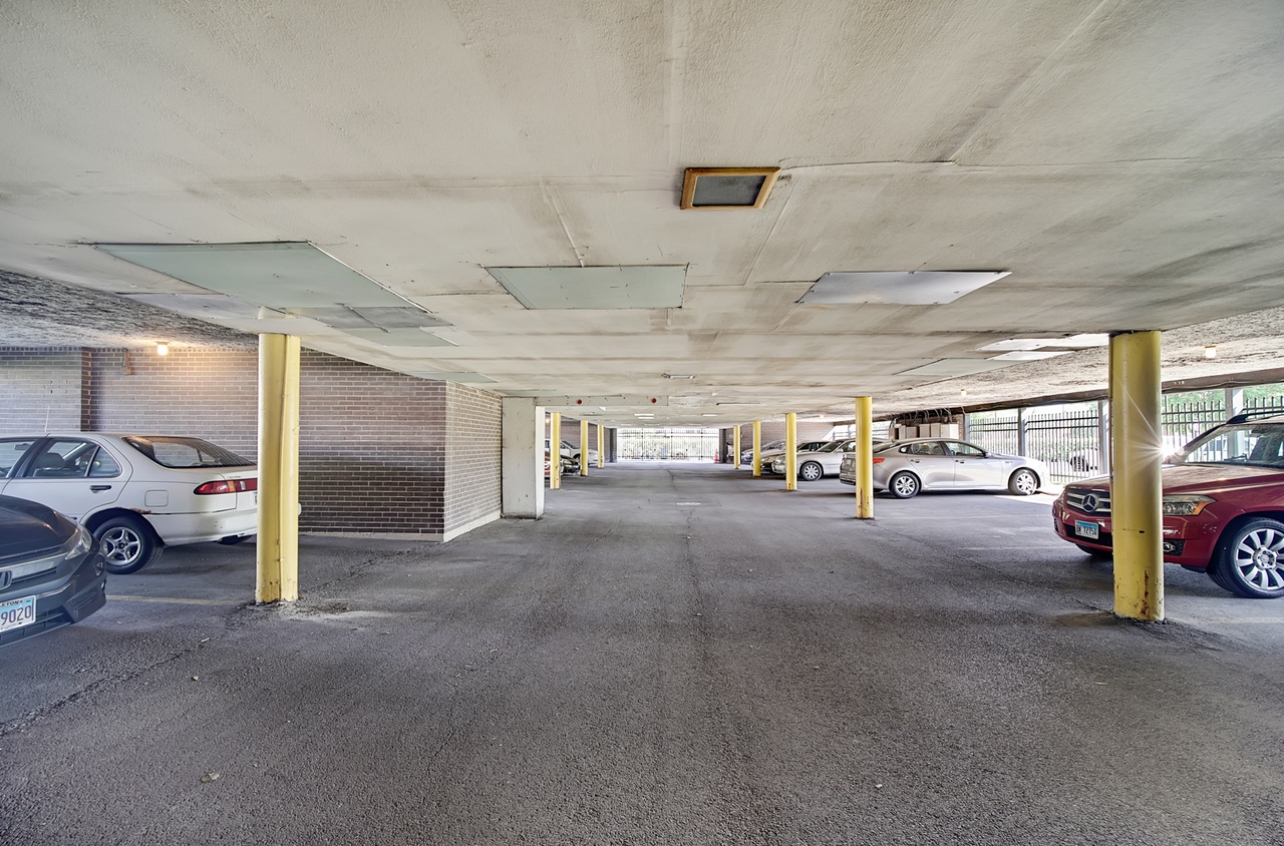 9820 South Pulaski Road, Unit 213 Oak Lawn, IL 60453 - Photo 15 of 18 a view of parking garage with cars