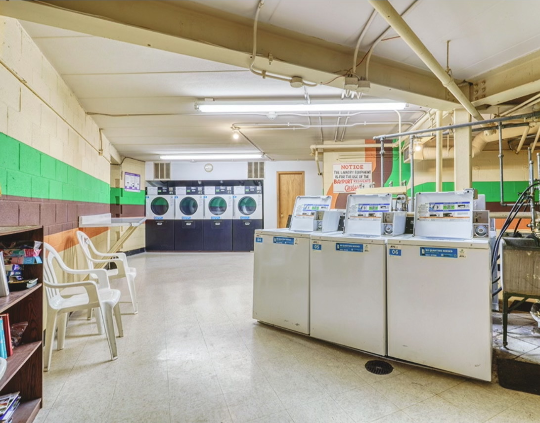 9820 South Pulaski Road, Unit 213 Oak Lawn, IL 60453 - Photo 18 of 18 a living room with furniture and a chandelier