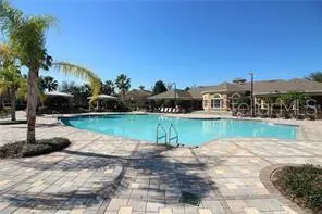 a view of swimming pool with an outdoor seating