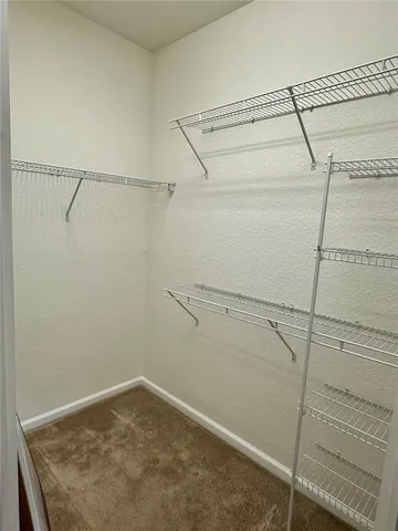 a view of a room with racks on the wall