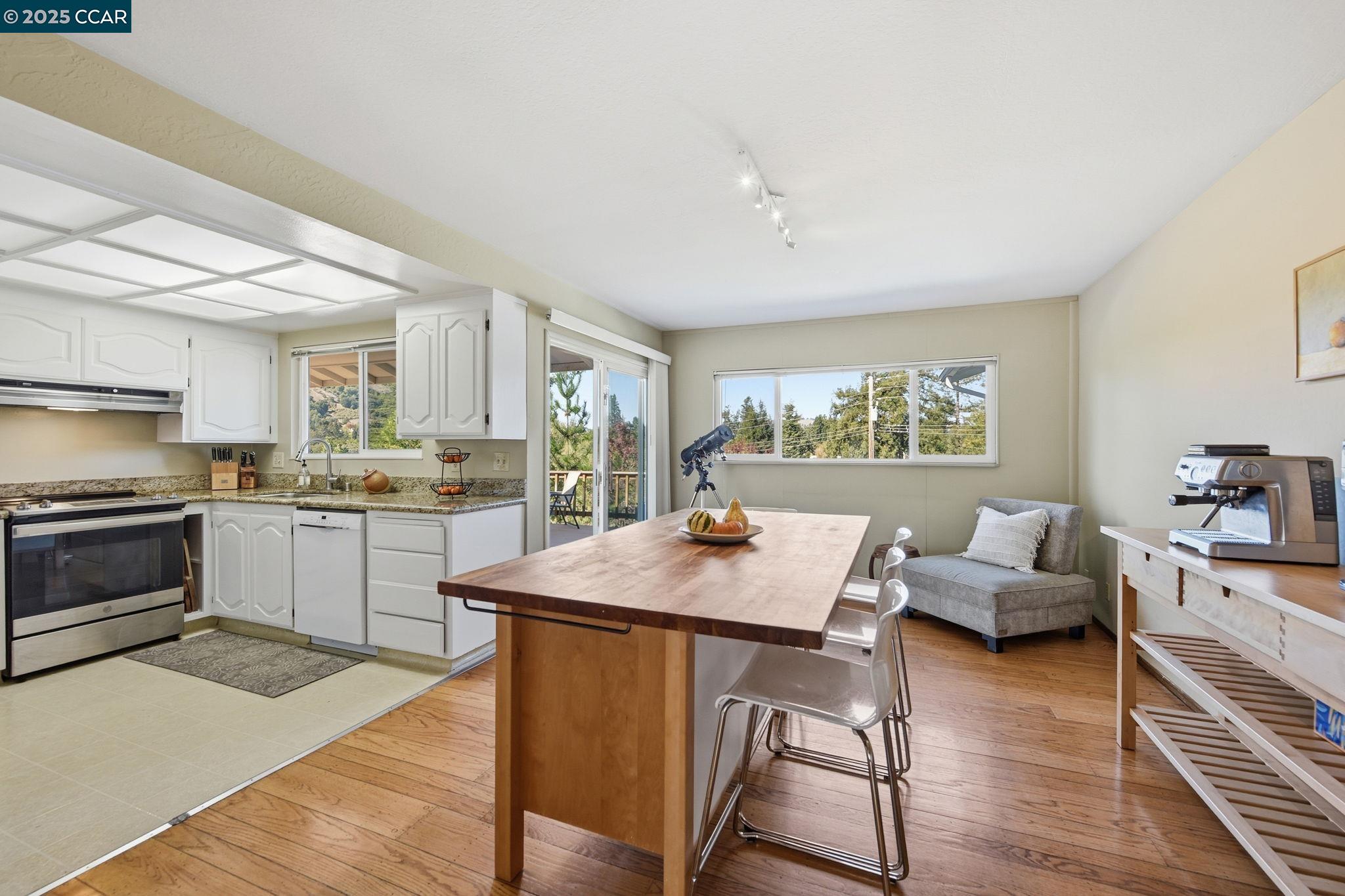 92 Gaywood Place Moraga, CA 94556 - Photo 11 of 52 a open kitchen with white cabinets and stainless steel appliances