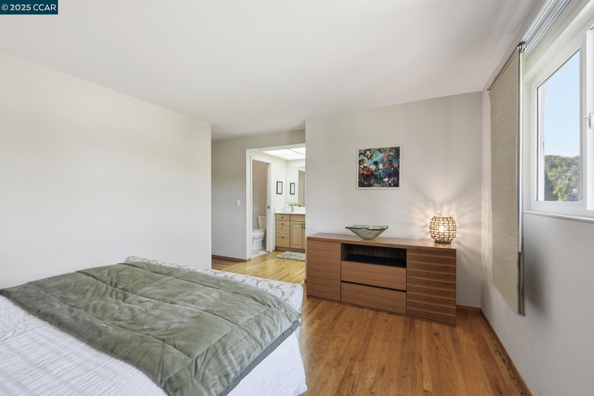 92 Gaywood Place Moraga, CA 94556 - Photo 13 of 52 a bedroom with a bed and wooden floor