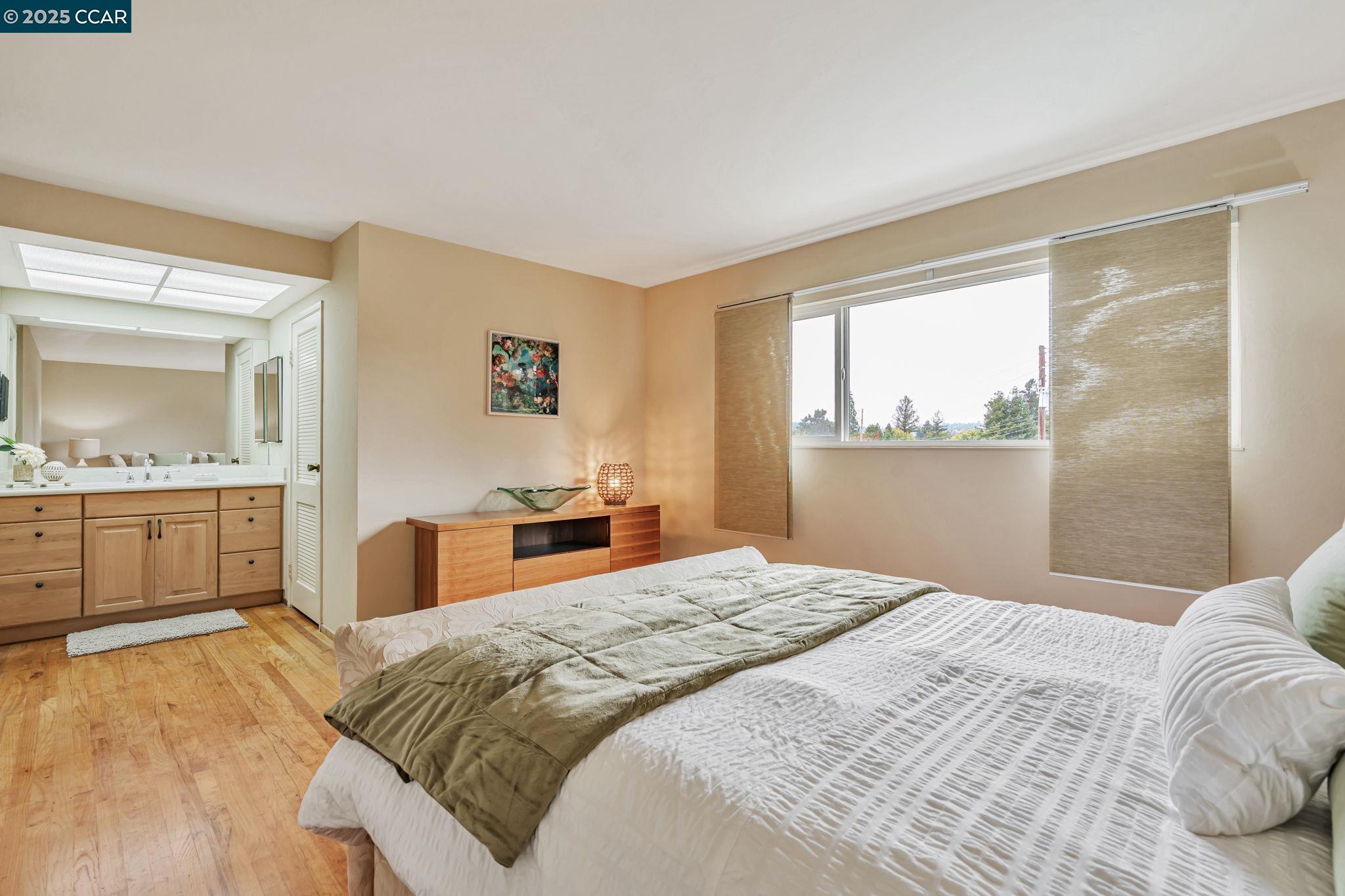 92 Gaywood Place Moraga, CA 94556 - Photo 14 of 52 a bedroom with a large bed and a large mirror