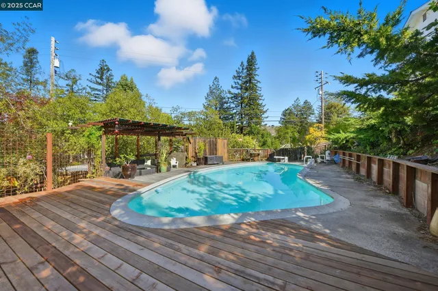 a view of a swimming pool with a patio