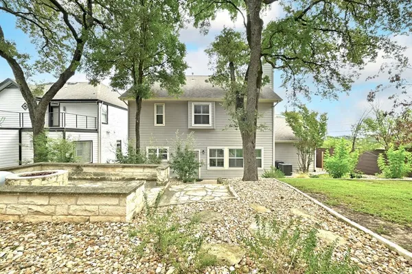 a house with trees in front of it