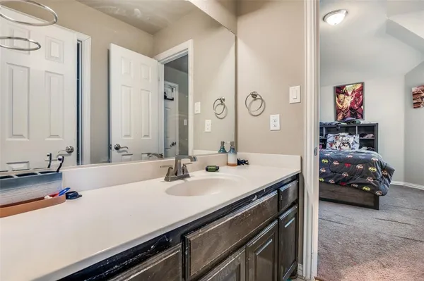 a bathroom with a sink double vanity and a mirror