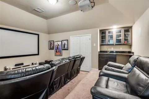 a living room with furniture kitchen and a sink