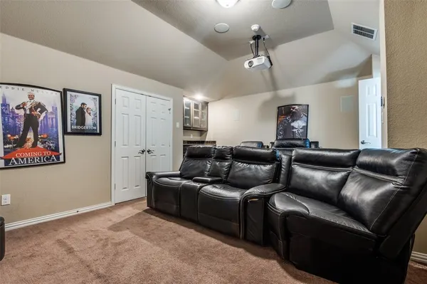 a living room with furniture a ceiling fan and a rug