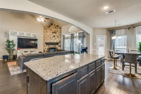 a room with furniture pool table and flat screen tv