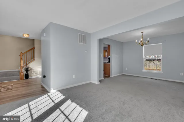 a view of livingroom with hardwood floor and hallway