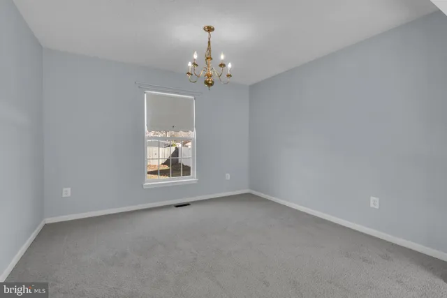 a view of room with window and ceiling fan