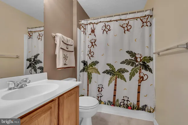 a bed room with a bed and a television