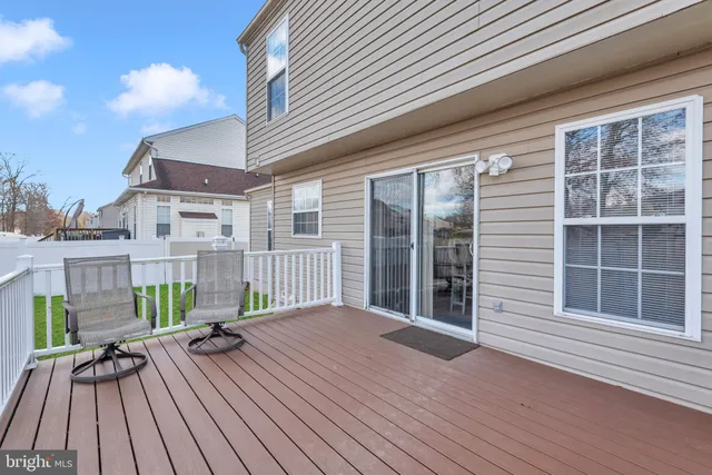 a view of a balcony with wooden floor