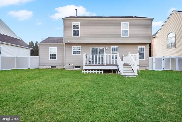 a front view of house with a garden