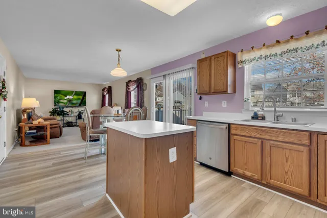 a large kitchen with a lot of counter space and a sink