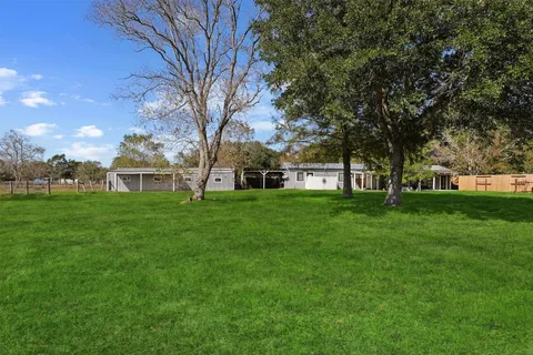 a view of a house with a big yard