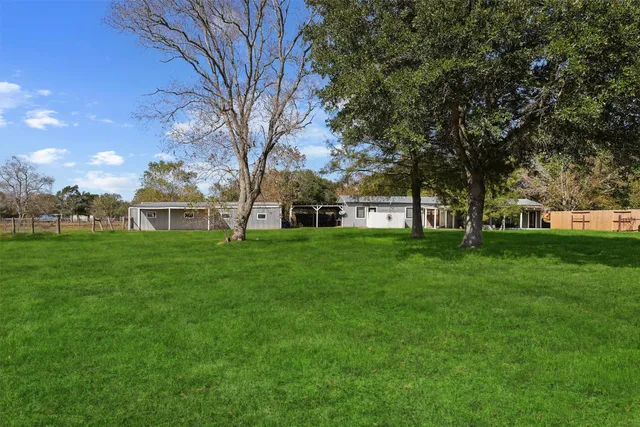 a view of a house with a big yard