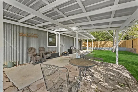 a view of swimming pool with a patio