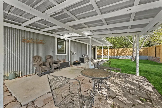 a view of swimming pool with a patio
