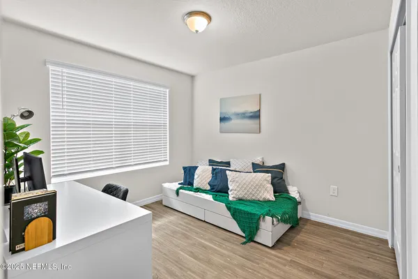 a living room with furniture and a window