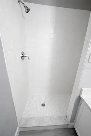 a view of a yard with wooden fence