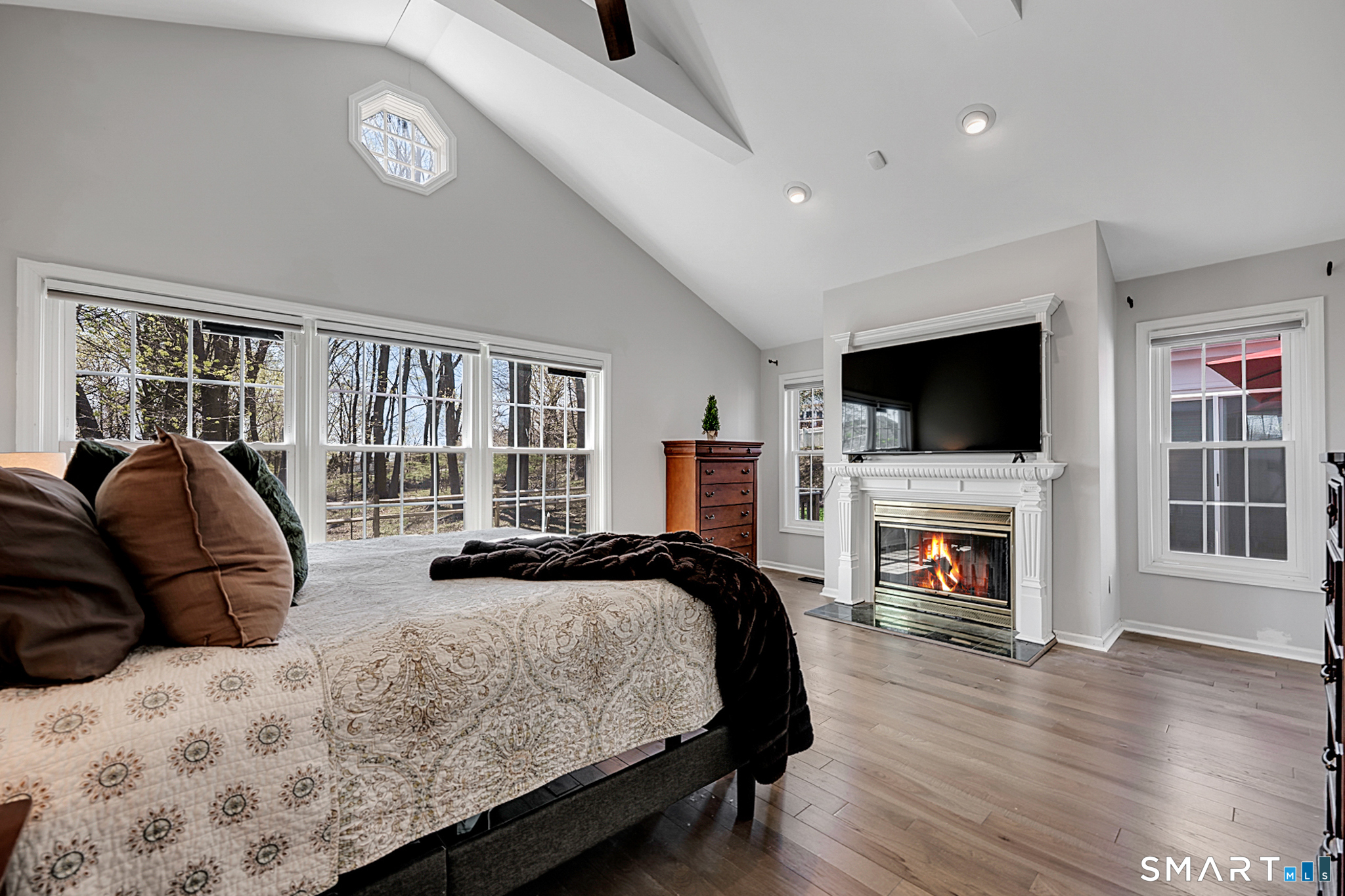 273 Osborne Hill Road Fairfield, CT 06824 - Photo 15 of 40 The wall of windows provides a serene view of the backyard. Motorized shades allow you to adjust the light.