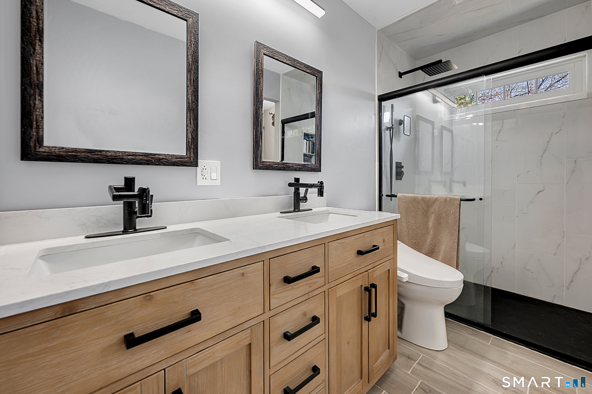 273 Osborne Hill Road Fairfield, CT 06824 - Photo 16 of 40 The updated Primary Bathroom offers dual vanities and a large shower.