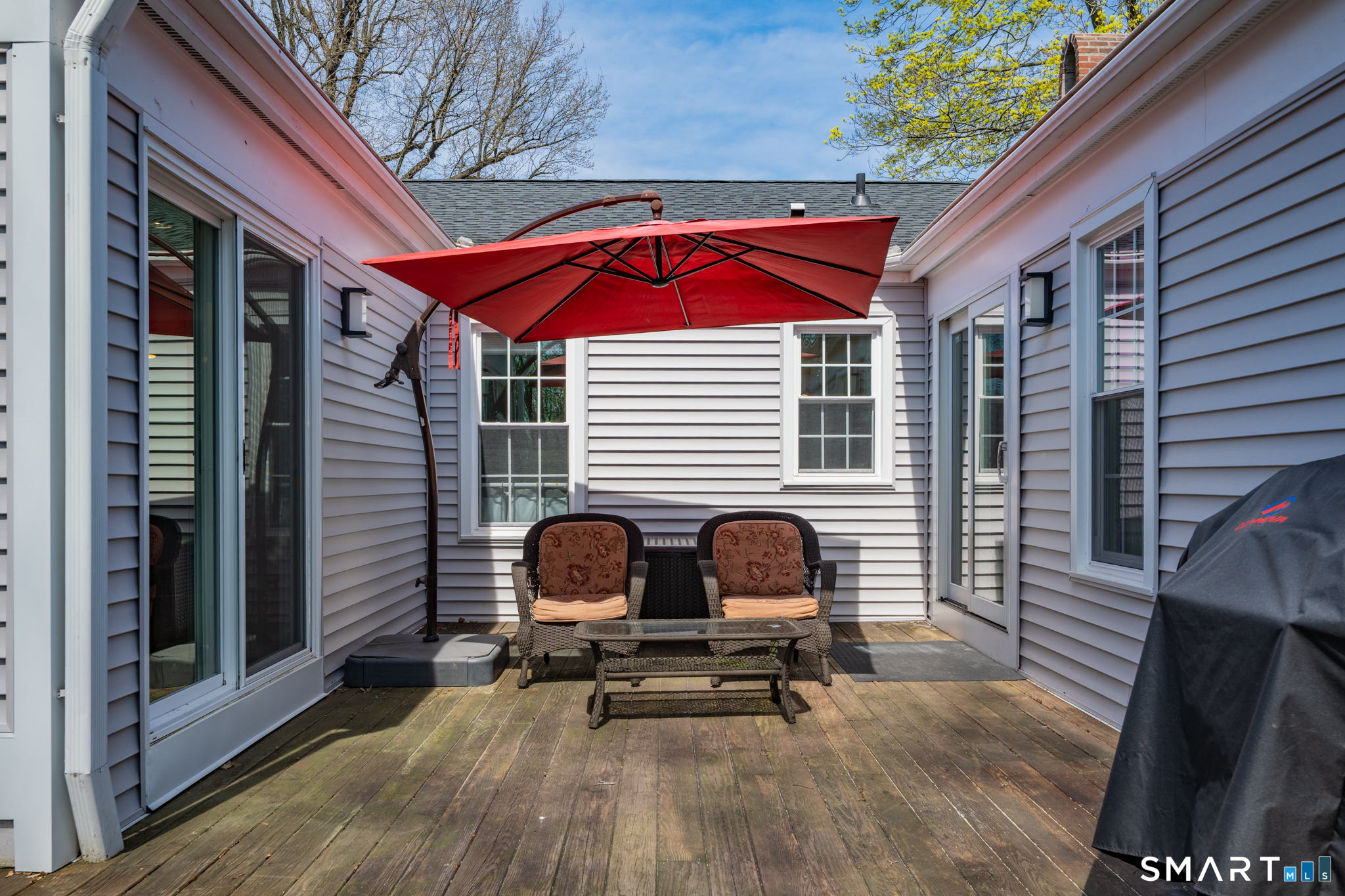 273 Osborne Hill Road Fairfield, CT 06824 - Photo 32 of 40 The expansive deck offers a picturesque view of the backyard.