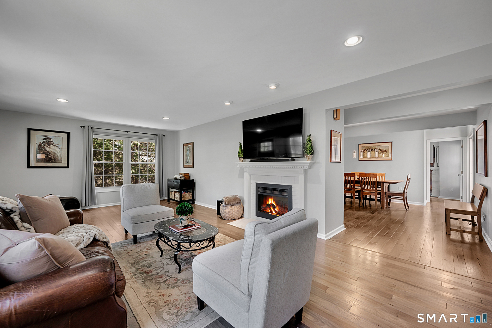 273 Osborne Hill Road Fairfield, CT 06824 - Photo 5 of 40 The spacious Living Room has a fireplace and hardwood floors.