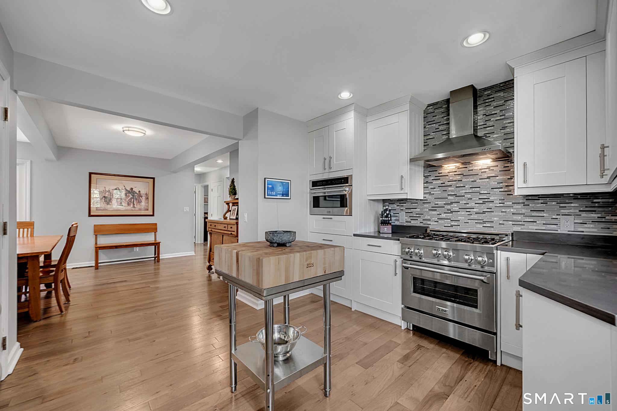 273 Osborne Hill Road Fairfield, CT 06824 - Photo 10 of 40 The Kitchen seamlessly runs into the Dining Room.