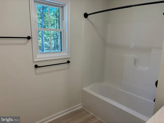 a bathroom with a bath tub and a shower