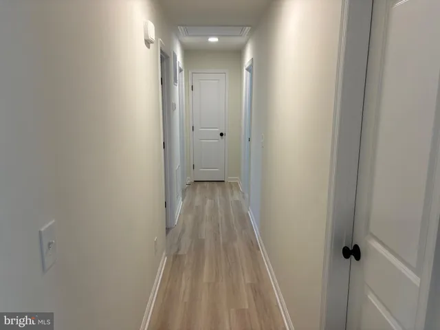 a view of a bathroom from a hallway