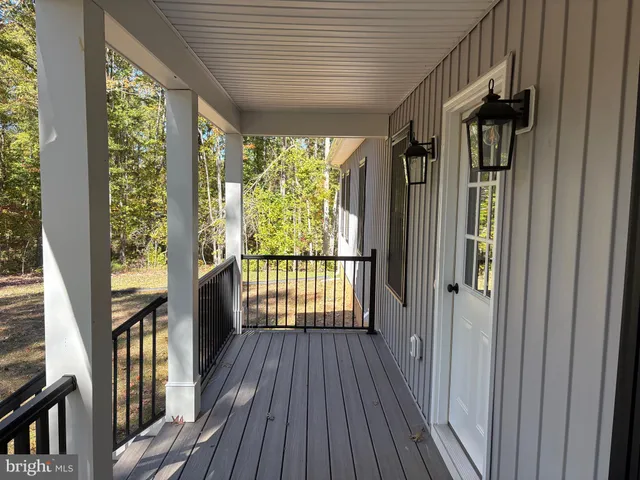 a view of balcony with wooden floor