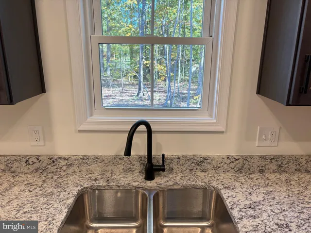 a close view of a sink and a window