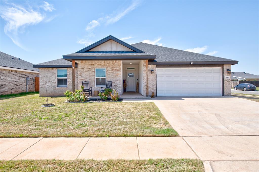 1640 Bandolero Road Abilene, TX 79602 - Photo 1 of 1 a front view of a house with garden
