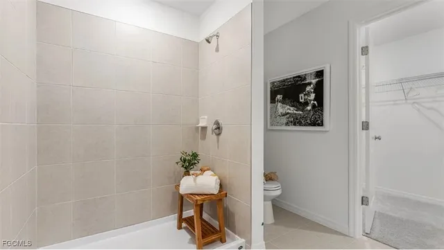 a bathroom with a shower toilet and sink