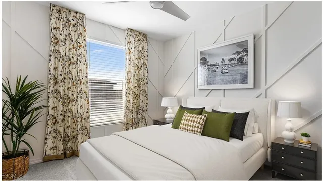 a bedroom with a bed and a potted plant